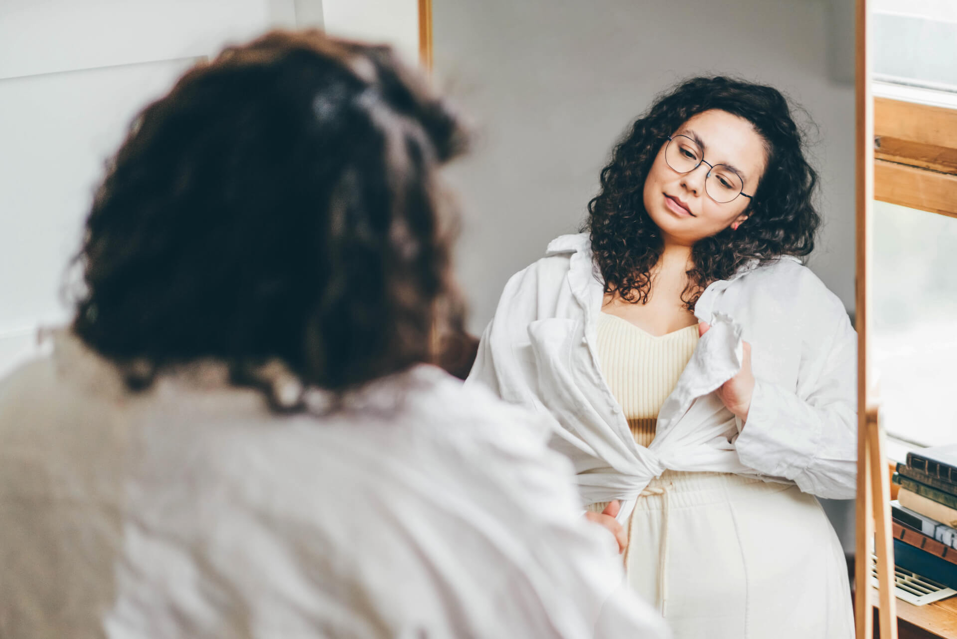 A person with type 1 diabetes checking their blood sugar level, representing the challenge of managing both T1D and obesity.